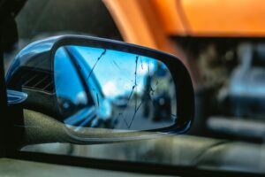Close-up of a broken side-view mirror